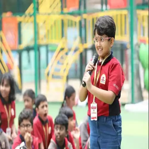 one girl by wearing orchids school uniform giving Speech
